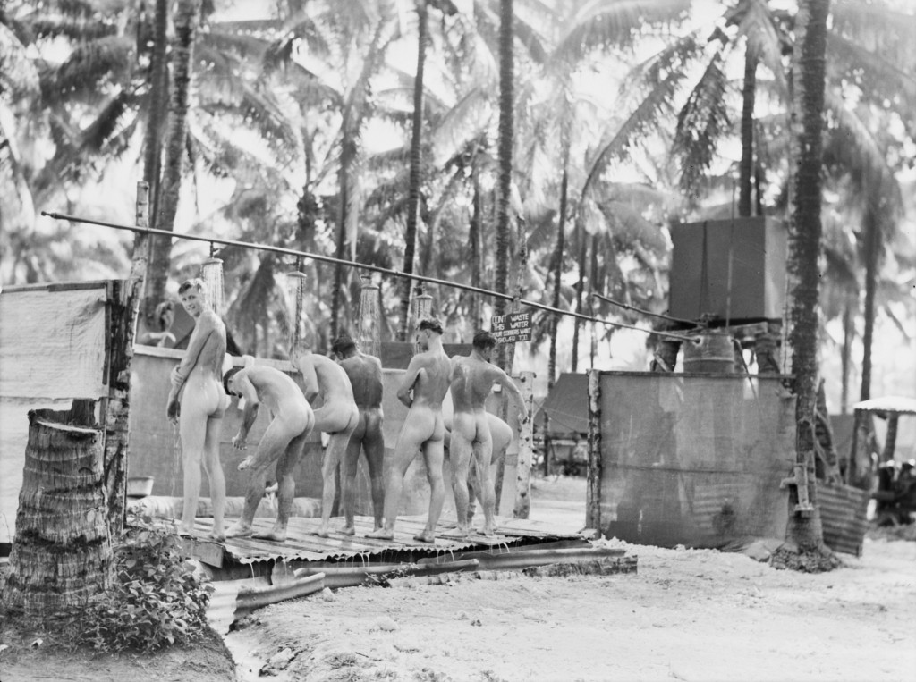 Alexishafen, New Guinea. 1944-09-13. Troops of the 133rd Brigade Workshops enjoying clean-up in the unit showers. (Australian War Memorial, 075851)