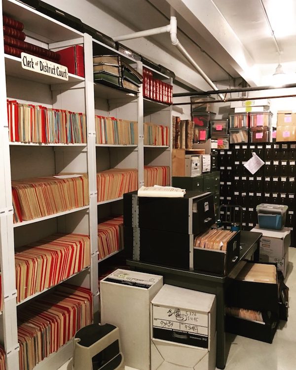 Criminal (red folders) and civil (manila folders) case files. Vault of the Cheyenne County District Court, Cheyenne County Courthouse. Sidney, Nebraska.