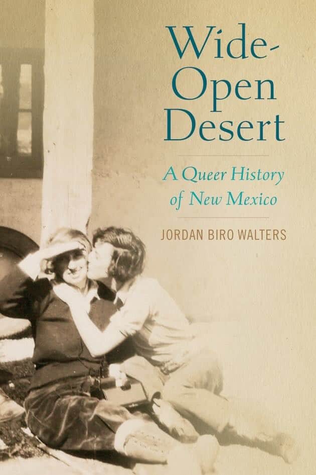 Cover for the book, Wide-Open Desert, featuring a photo of two women seated, one kissing the other.